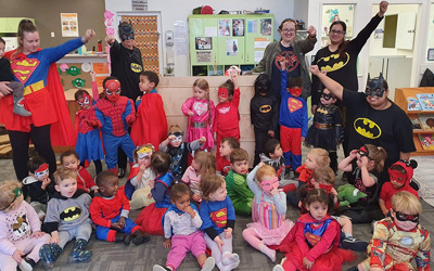 Superhero day children, teachers and parents at Lollipops Pukekohe daycare
