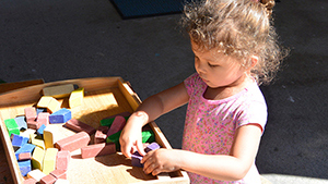 girl at daycare spontaneously playing